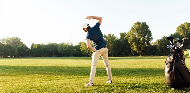 Gold and Chiropractic - golfer stretching